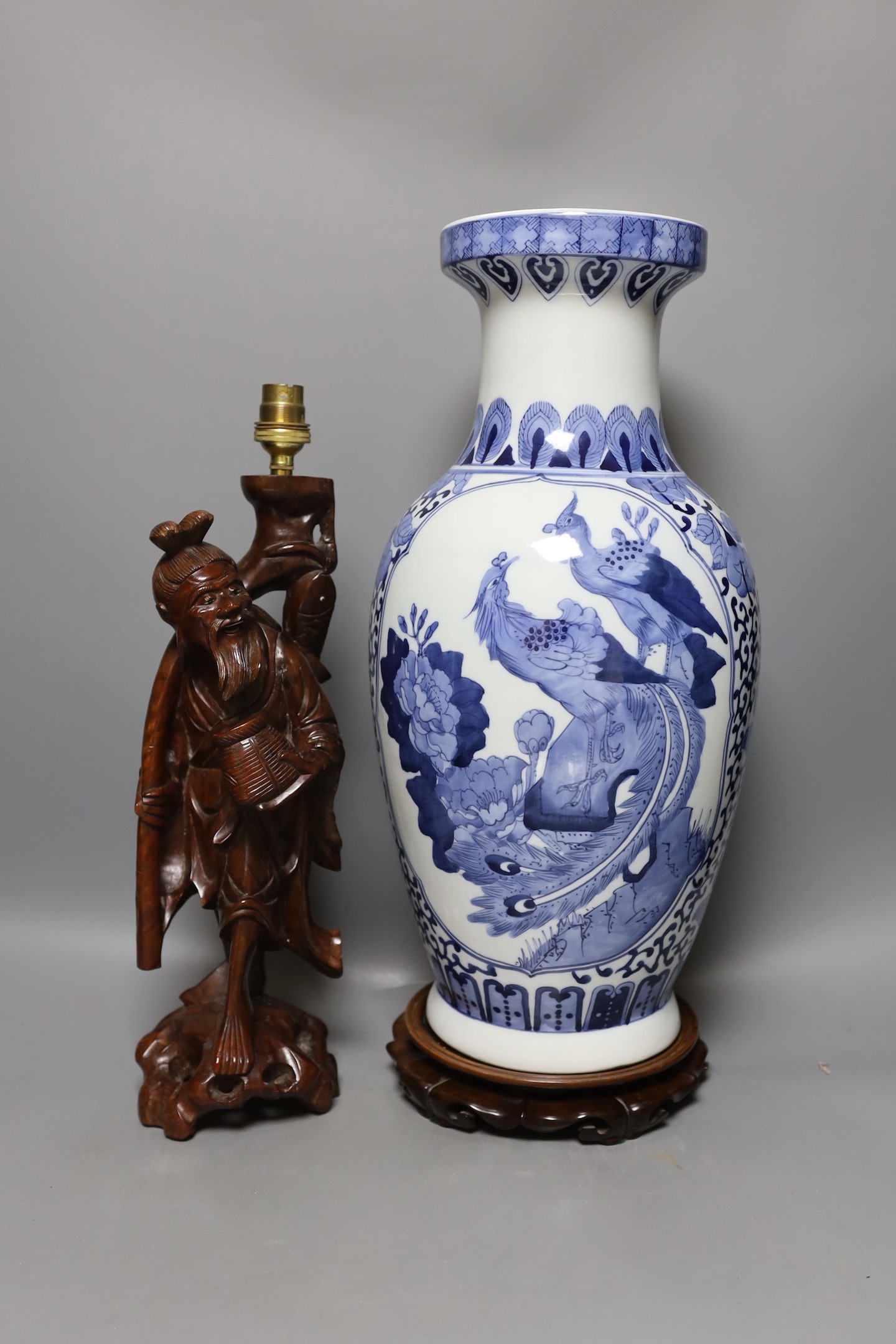 A large Chinese blue and white vase, 50cm tall, and a Chinese fisherman lamp